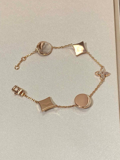 [BLUE TEARS]STAR AND SUN 5 MOTIF MOP PINK GOLD BRACELET