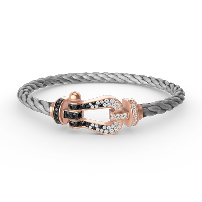 [BLAUE TRÄNEN]FORCE GROSSES HUFEISENARMBAND MIT SCHWARZEN WEISSEN DIAMANTEN UND ROSÉGOLD