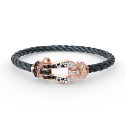 [BLAUE TRÄNEN]FORCE GROSSES HUFEISENARMBAND MIT SCHWARZEN WEISSEN DIAMANTEN UND ROSÉGOLD