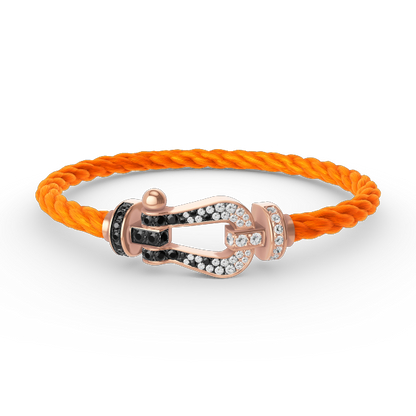 [BLAUE TRÄNEN]FORCE GROSSES HUFEISENARMBAND MIT SCHWARZEN WEISSEN DIAMANTEN UND ROSÉGOLD