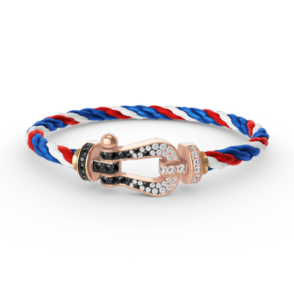 [BLAUE TRÄNEN]FORCE GROSSES HUFEISENARMBAND MIT SCHWARZEN WEISSEN DIAMANTEN UND ROSÉGOLD