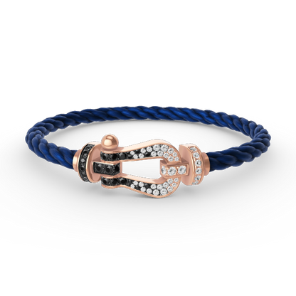 [BLAUE TRÄNEN]FORCE GROSSES HUFEISENARMBAND MIT SCHWARZEN WEISSEN DIAMANTEN UND ROSÉGOLD