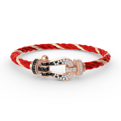 [BLAUE TRÄNEN]FORCE GROSSES HUFEISENARMBAND MIT SCHWARZEN WEISSEN DIAMANTEN UND ROSÉGOLD