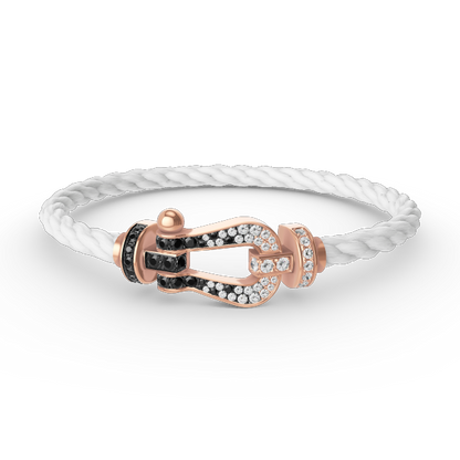 [BLAUE TRÄNEN]FORCE GROSSES HUFEISENARMBAND MIT SCHWARZEN WEISSEN DIAMANTEN UND ROSÉGOLD